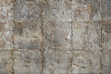 Wall Mural - concrete wall after dismantling of big tiles under direct sun light full-frame background and texture