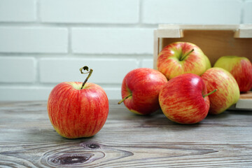 Wall Mural - red apples on wooden table