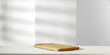 Wooden pedestal of free space for your decoration and wall with shadows. 