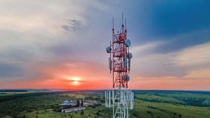 Telecommunication Antenna receiver on cell phone tower with 5G base station transceiver, aerial view.