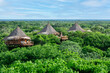 Aerial panoramic view of a bungalow nature village in the middle of the forest. 