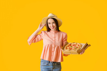 Poster - Beautiful young woman with tasty pizza on color background