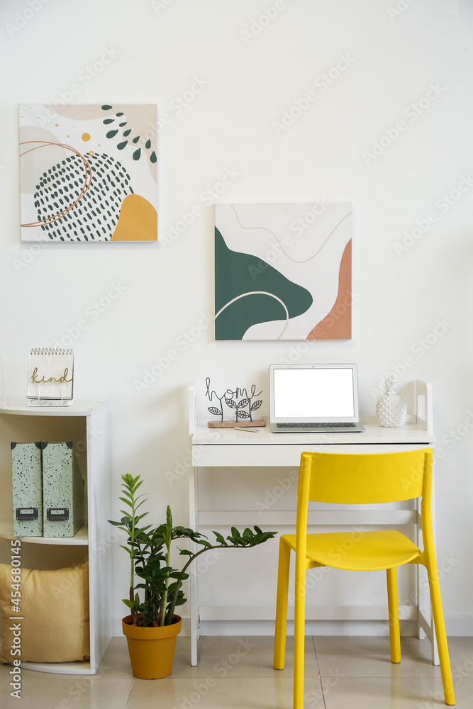 Interior of stylish room with modern workplace