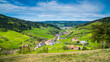 Germany, Idyllic schwarzwald village elzach yach houses surrounded by majestic forest covered mountains nature landscape perfect for hiking and tourism