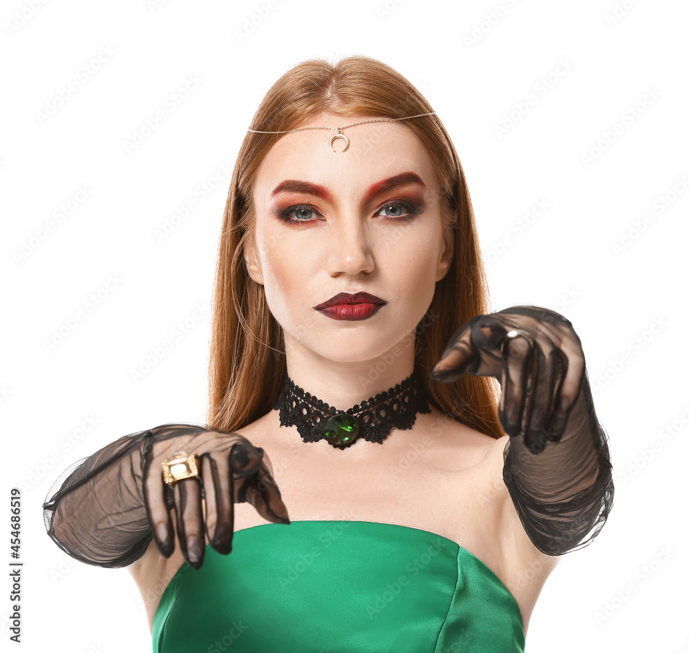 Beautiful woman dressed as witch for Halloween on white background