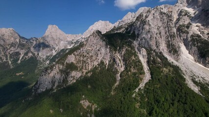 Wall Mural - Flying over Alps in Albania, beautiful mountains with high peaks and green forests