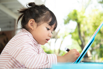 Wall Mural - Asian Children learn to draw in the classroom.