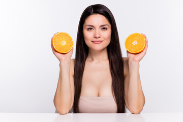 Wall Mural - Photo portrait woman long brunette hair smiling keeping juicy oranges isolated white color background