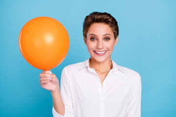 Sticker - Photo of funny blond millennial lady hold balloon wear shirt isolated on blue color background