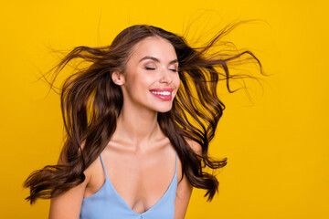 Sticker - Profile side photo of young attractive woman happy positive smile wind blow haircare conditioner isolated over yellow color background