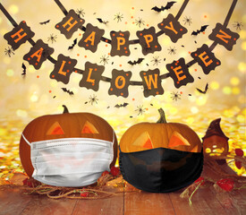 Wall Mural - holidays and health concept - carved pumpkins or jack-o-lanterns in medical masks on wooden table over happy halloween banner and lights on background