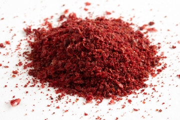 Wall Mural - red chili powder on a white background