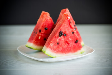 Wall Mural - pieces of fresh ripe red watermelon on table