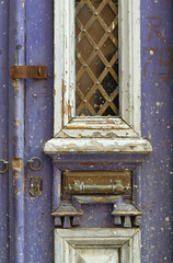 Wall Mural - old traditional door, made of wood and metal. door in purple