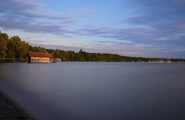 High angle shot of a tranquil lake and forests on the shore in the background