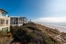 High Angle View From Wooden Pavilion Gazebo By Beach At Gulf Of Mexico At Seaside, Florida By New Urbanism Rental House Home Architecture With People Walking On Ocean Sea Coast