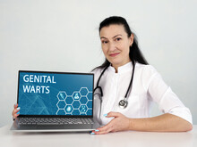  GENITAL WARTS Inscription On The Screen. Close Up Immunologist Hands Holding Black Laptop.