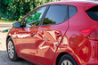 © Mikhail - red car hatchback with a dent after an accident