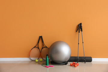 Sticker - Set of sports equipment on floor near color wall