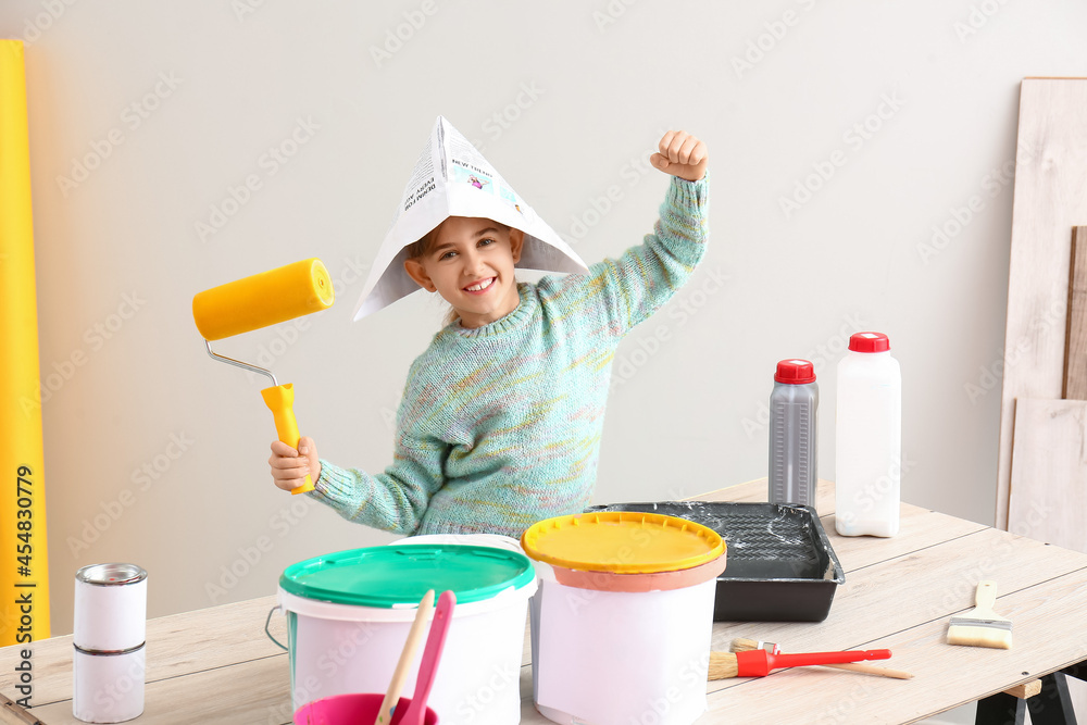 Little painter with tools at home