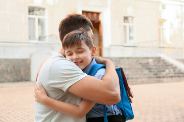 Sticker - Father saying goodbye to his son near school