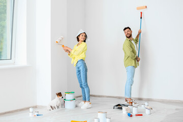 Sticker - Young couple with cute dog doing repair of their new house