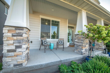 Wall Mural - Front porch of a house with two chairs and mint green table