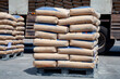Cement bags are placed on pallets and stored in warehouses, Cement bags for construction, Cement industry  business.