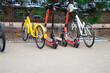 electric scooters , bicycles in parking lot. Electric vehicle rental to move around the city. ECO concept, ecology care. Trendy transport. Parking for electric scooters and bicycles. mobile scooter