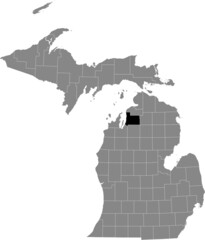 Black highlighted location map of the Antrim County inside gray map of the Federal State of Michigan, USA