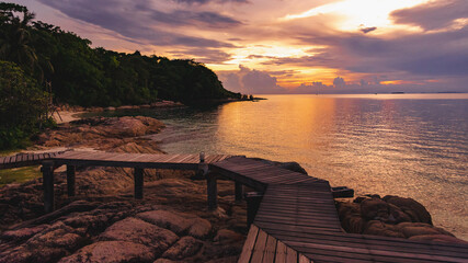 Wall Mural - Nature in twilight period which including of sunrise over the sea and the nice beach. Summer beach with blue water and purple sky at the sunset.	
