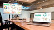 © Ratchapon - Mock up sales summary slide show presentation on display laptop and television with coffee cup on table in meeting room