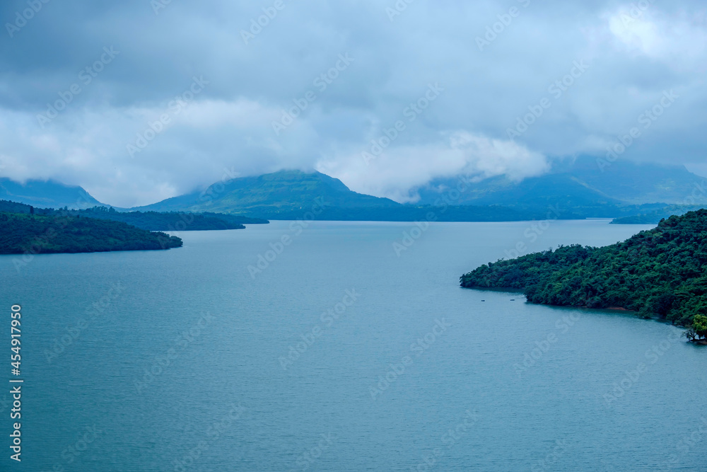 Aerial view of greenery, lake and clouds during the monsoon season at ...