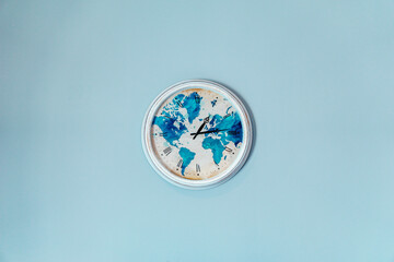 Canvas Print - Closeup shot of a clock on the blue wall