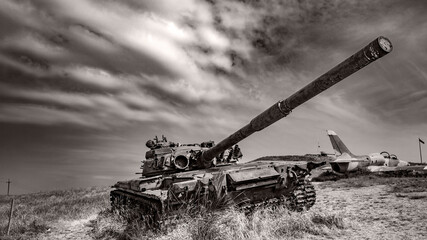 old rusty tank stands in a field