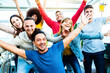 © Davide Angelini - Happy multiracial team of students with open arms smiling at camera together - Diverse young people celebrating success together - Community, diversity, human resources and happy lifestyle concept