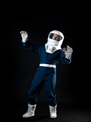 Wall Mural - An astronaut in weightlessness reaches up with his hand.