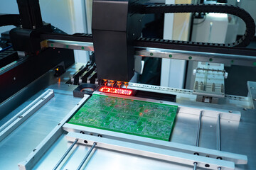 Poster - equipment for pcb assembly on cnc machine. laser printing on a computer board. robot fixes electroni