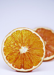 Wall Mural - Vibrant, healthy dehydrated orange slices isolated on white background