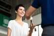 © NVB Stocker - Middle age mechanic man with beard gives the car key to female customer at Car maintenance station and automobile service garage