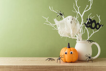 Halloween Holiday Decorations With Glitter Pumpkin, Spiders And Ghost On Wooden Table.