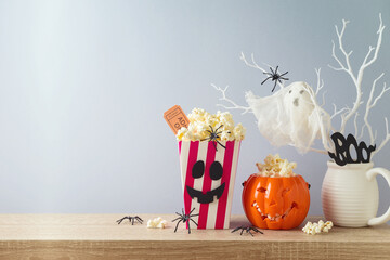 Wall Mural - Horror movie night and Halloween party concept with jack o lantern pumpkin and  popcorn on wooden table