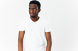 © SHOTPRIME STUDIO - portrait of handsome guy african looking white t-shirt cropped view