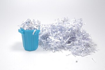 a Shredded documents to protect confidential information with e trash can