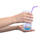 Hand with glass of water with juice straw for invalid person, caregiver concept photo