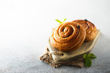 Wall Mural - Delicious homemade raisin pastry roll on a desk