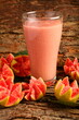 Homemade delicious red guava fruit smoothie juice served in glass, cold, chilled drinks background.
