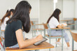 © EduLife Photos - Asian college students back to school wear protective facemask and keep social distance studying in the classroom