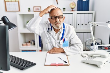 Sticker - Mature doctor man at the clinic confuse and wonder about question. uncertain with doubt, thinking with hand on head. pensive concept.