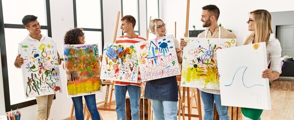 Poster - Group of people smiling happy canvas with draw standing at art studio.